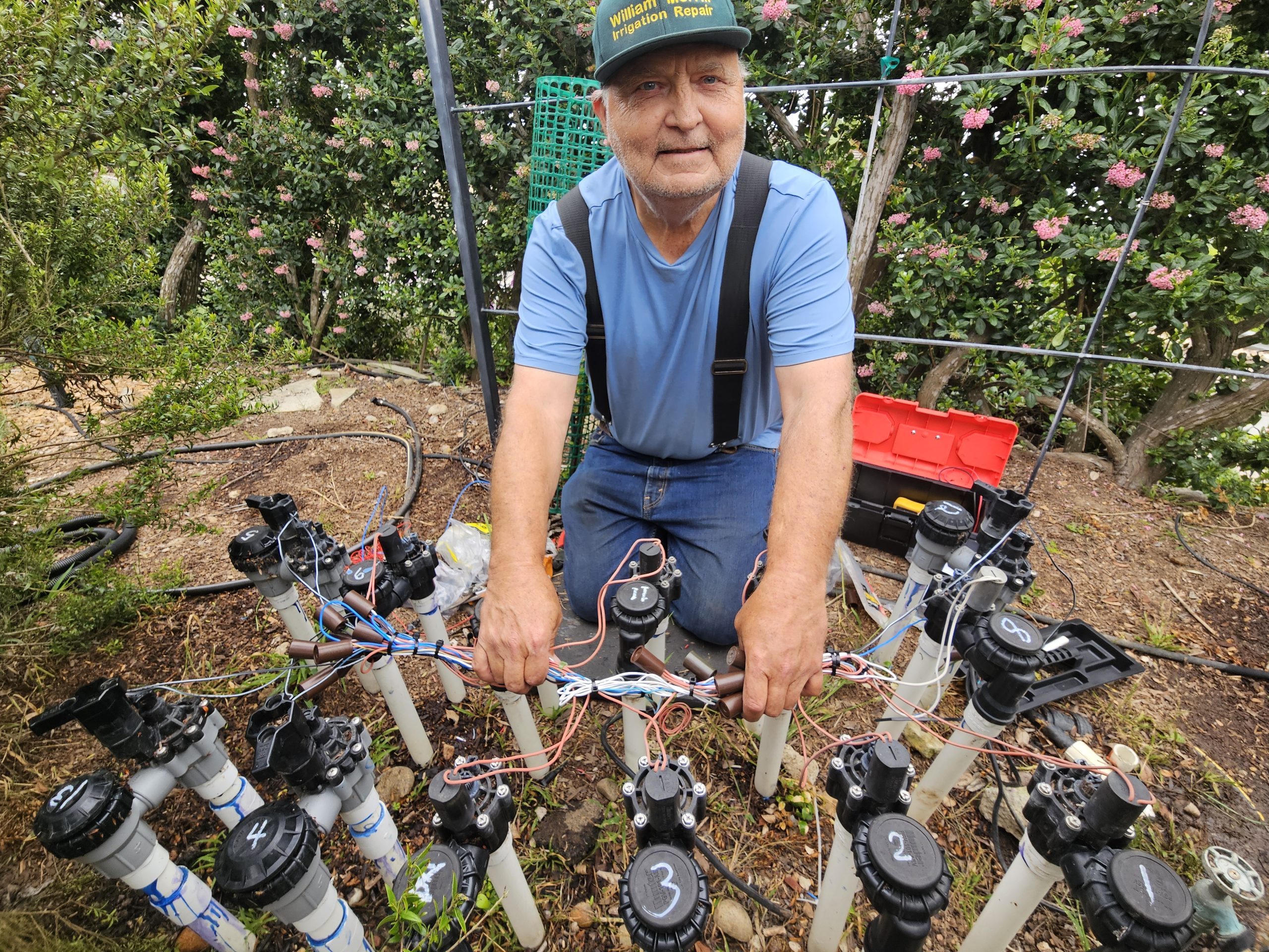 William Merrill working on irrigation manifold