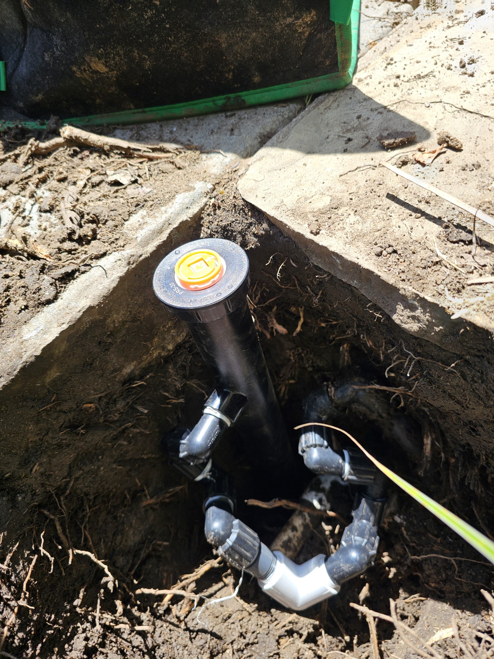 Pop-up sprinkler with multiple swing joint fittings